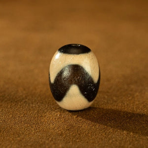 Harrowing Might Tiger Tooth Dzi Bead