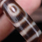 Embodiment of Harmony Amulet 2 Eye Dzi Bead